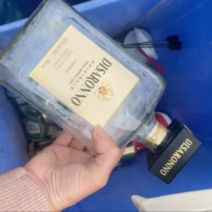 She pulls a bottle of alcohol from her recycling bin for this genius idea!