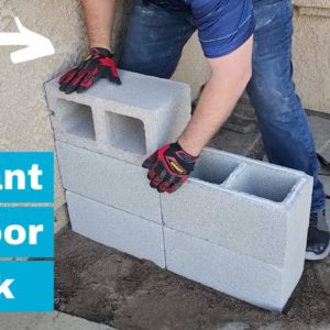 He stacks cinder blocks in his front yard for a brilliant outdoor furniture idea!