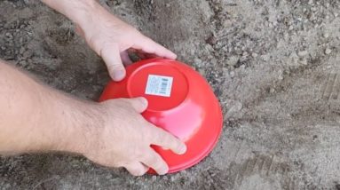 He lays a Dollar Store bowl in the dirt for this brilliant idea!