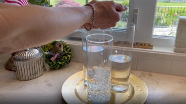 She drops sparkles in a glass of water for this breathtaking idea!