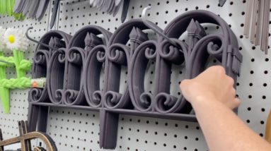 She hangs a Dollar Store fence from her ceiling…brilliant!