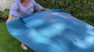 She lays a packing blanket in her backyard for a breathtaking idea!