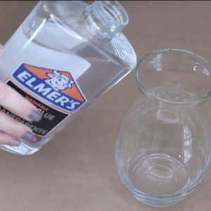 She pours Elmer's glue into a $1 vase for a breathtaking idea!