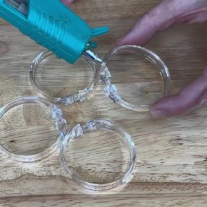 The genius reason she glues 4 shower curtain rings