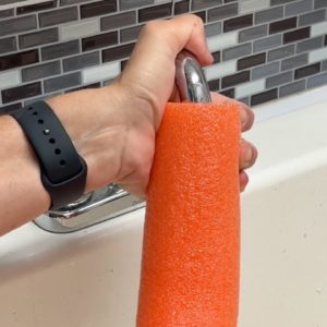 The brilliant reason she stuffs a faucet into a pool noodle