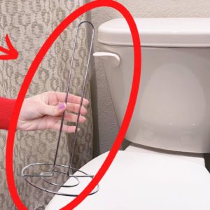 Stick a paper towel holder on your toilet (BRILLIANT!)